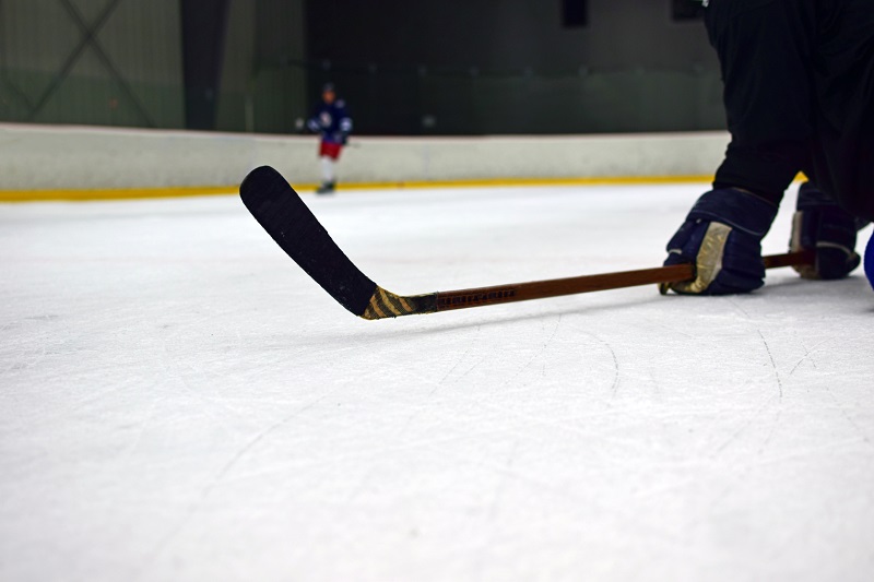 ice hockey player holding the senior stick